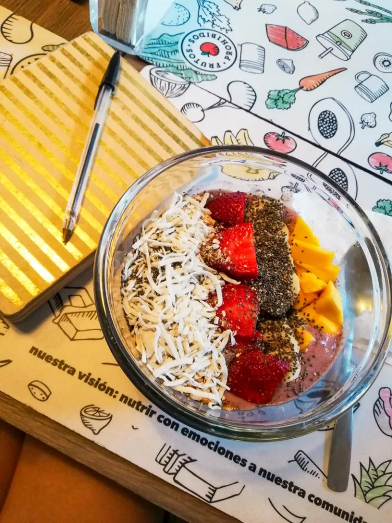 An acai bowl on a table at frutos prohibidos in roma norte, mexico city.