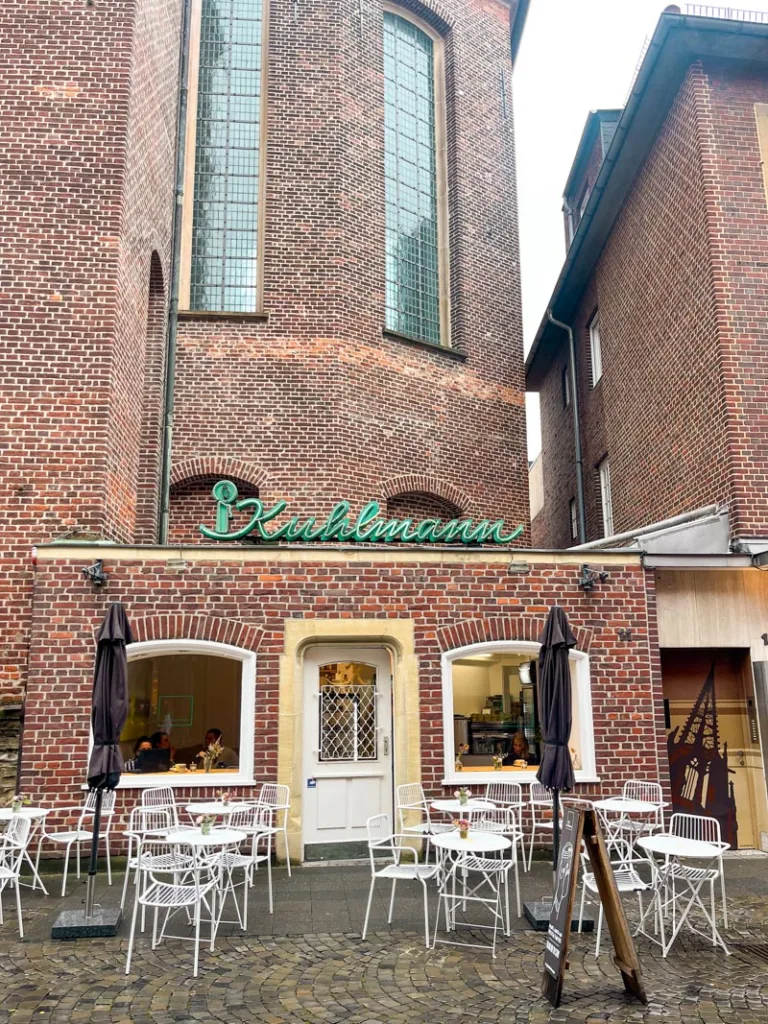 Cute red brick facade of Kuhlmann cafe in Münster, Germany