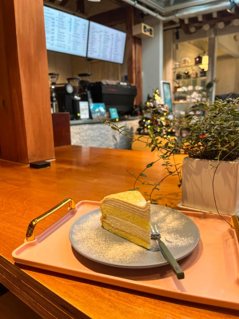 a slice of layered cake at cafe soodal in seoul