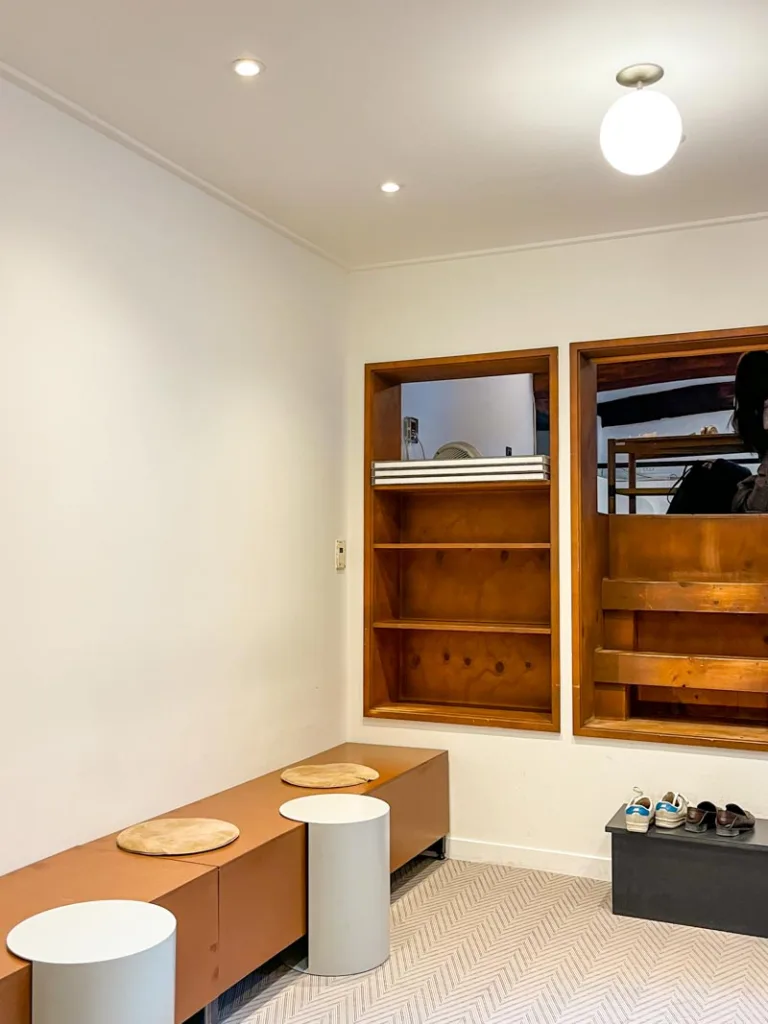 minimalist white walls and wood details inside namusairo coffee shop in seoul housed inside a renovated hanok