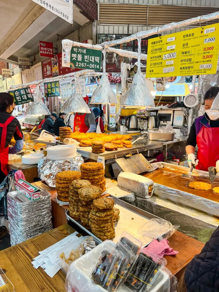 piles of mung bean pancakes at a stand at the Gwangjang food market
