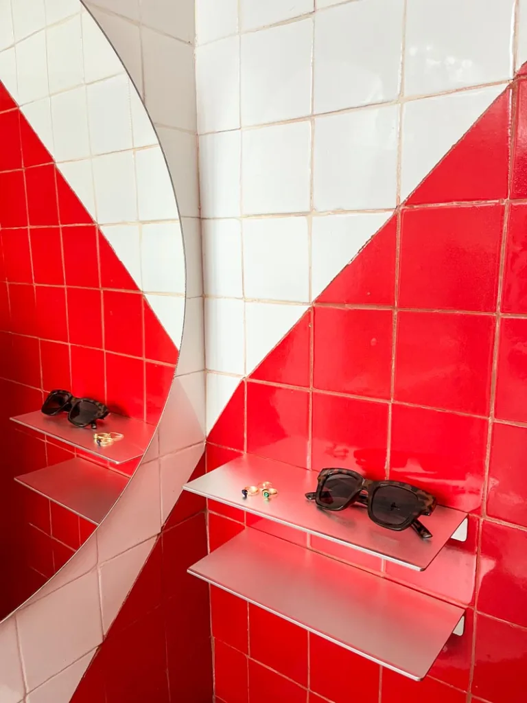 Red tile bathroom walls at Ayook boutique hotel in Oaxaca City
