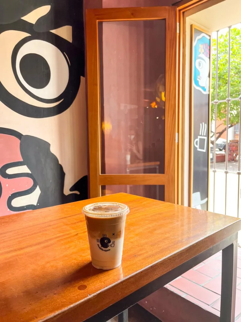 iced latte in a to-go cup at Cafe Brujula in Oaxaca City