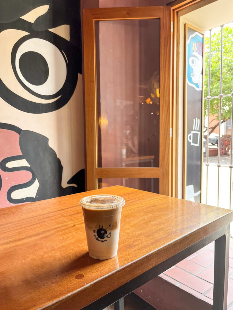 iced latte in a to-go cup at Cafe Brujula in Oaxaca City
