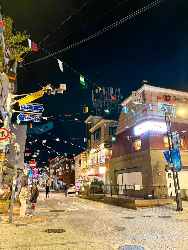 cute seoul street covered with colorful flags dangling above the street