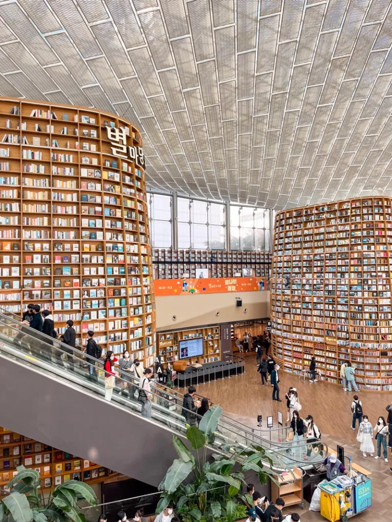 panoramic view of bookshelves expanding from floor to ceiling at the coex library in seoul