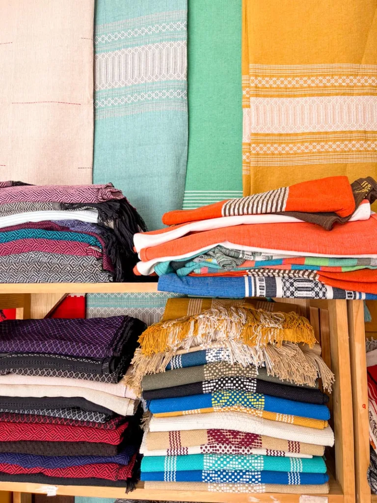 display of colorful textiles at mercado de artesanias, one of the best things to do in oaxaca city