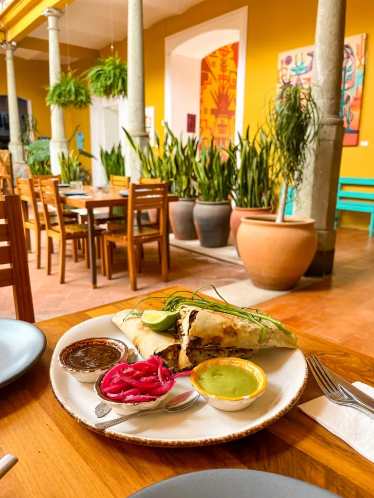 a plate with a massive tlayuda at a restaurant in oaxaca city