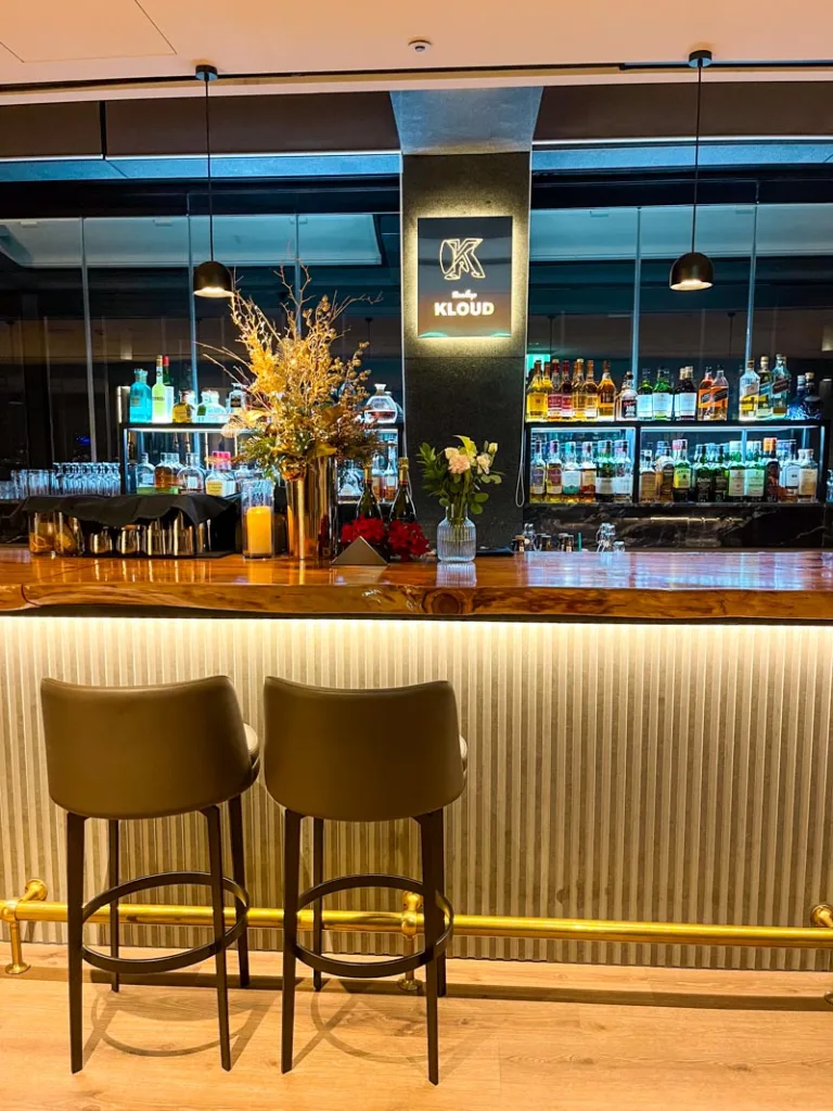 two bar stools by an elegant bar at rooftop kloud bar in seoul