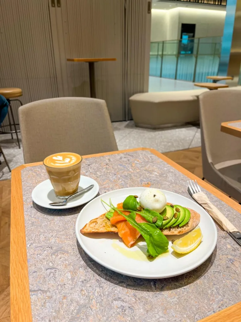 Salmon avocado toast with an egg and a latte at Allpress Espresso Toranomon Cafe in tokyo