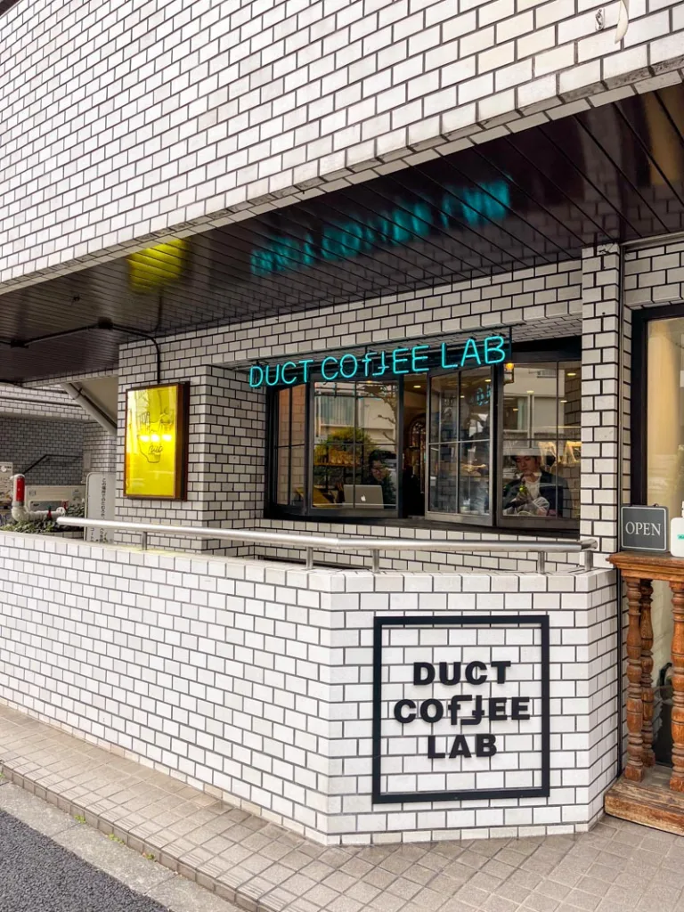 white tile facade of duct lab coffee shop in tokyo