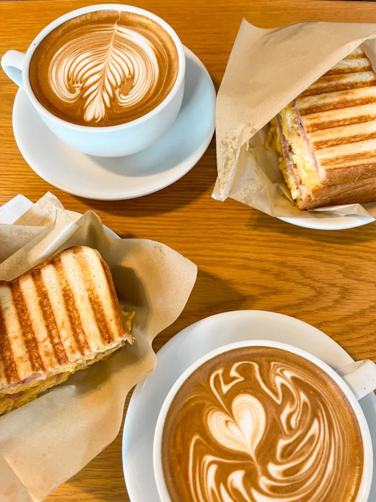view from above of two lattes and two breakfast sandwiches at streamer coffee shop in tokyo