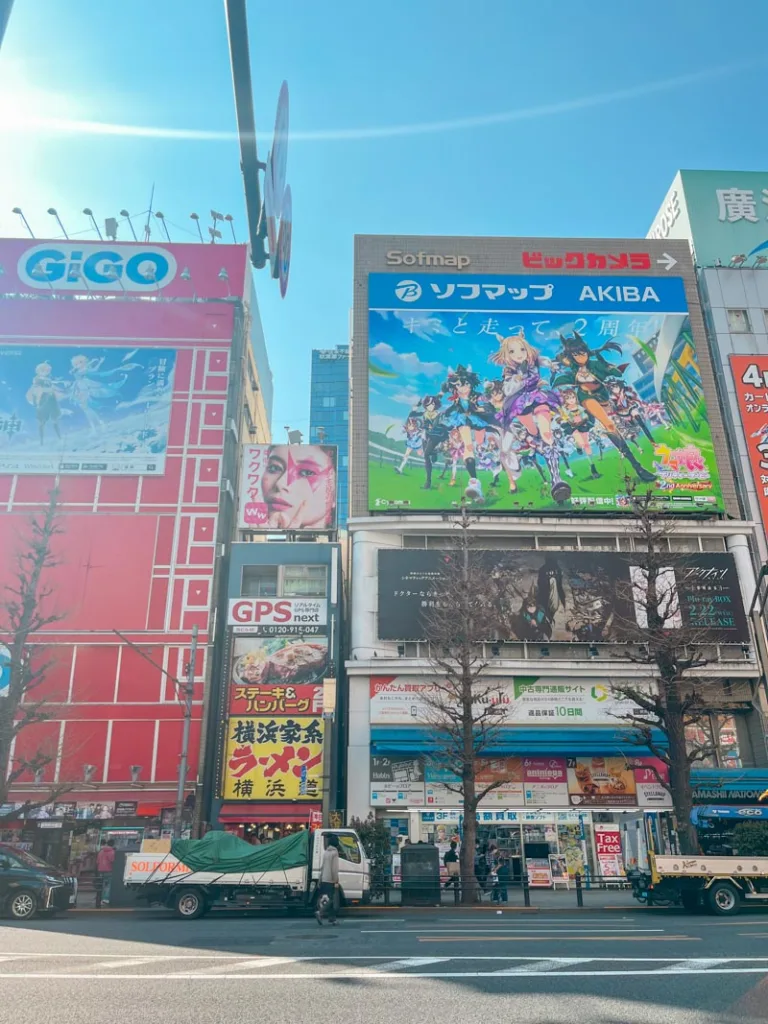 buildings with massive manga art on display in the front at akihabara, tokyo