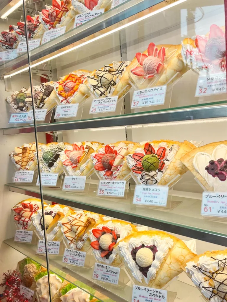 crepes on display behind glass at a crepe stand in harajuku, tokyo