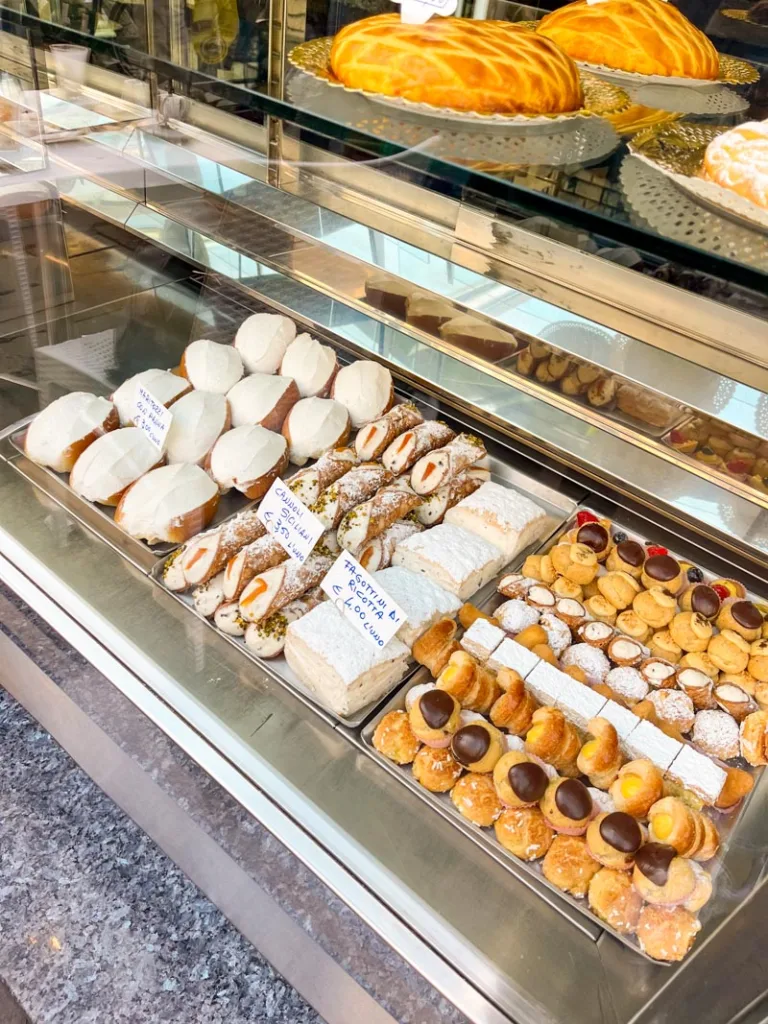 various italian pastries on display at regoli pasticceria in rome