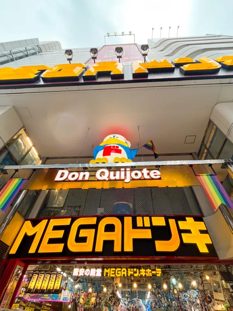 big mega sign outside don quijote in shibuya, all in yellow letters