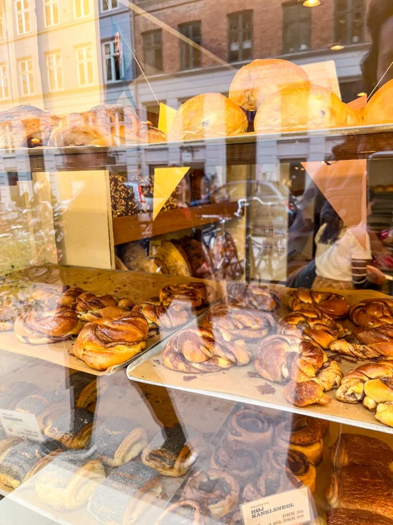 cinnamon rolls on a window display at meyers bakery in copenhagen