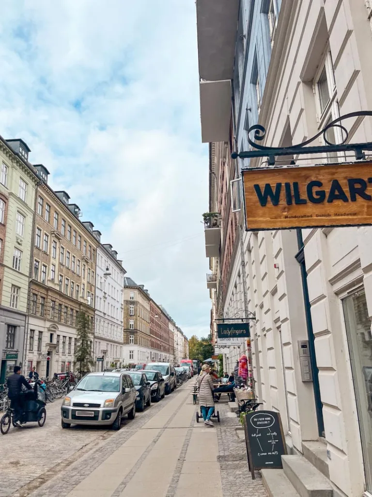 view of Jægersborggade street in copenhagen lined with shops and cafes