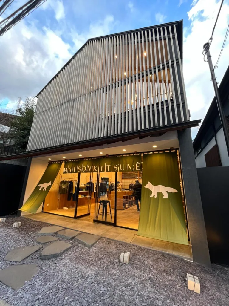 shiny, modern looking facade of a maison kitsune shop in daikanyama, tokyo