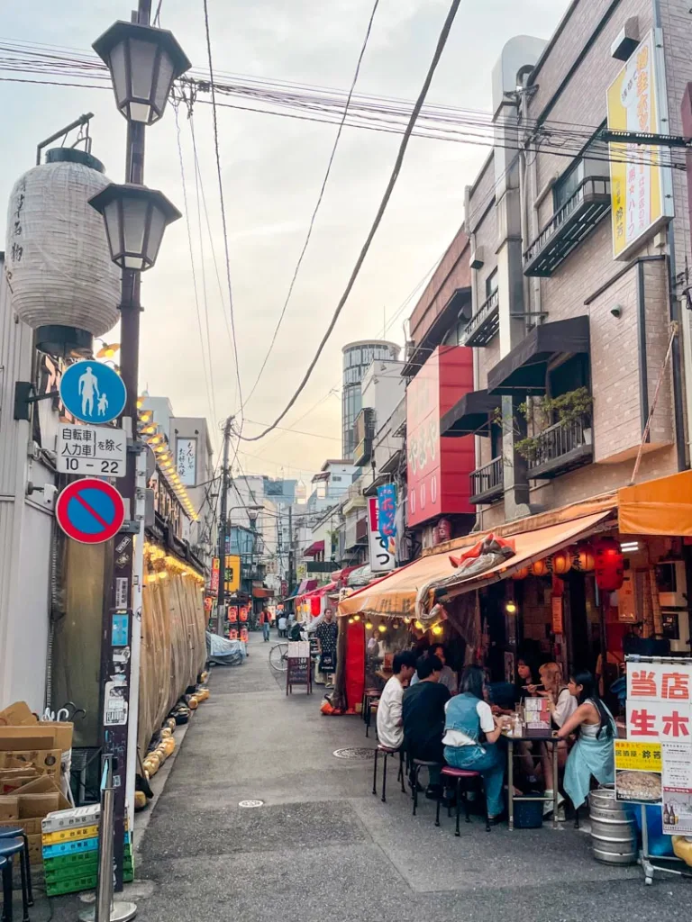 casual food stands lining hoppy street in asakusa tokyo