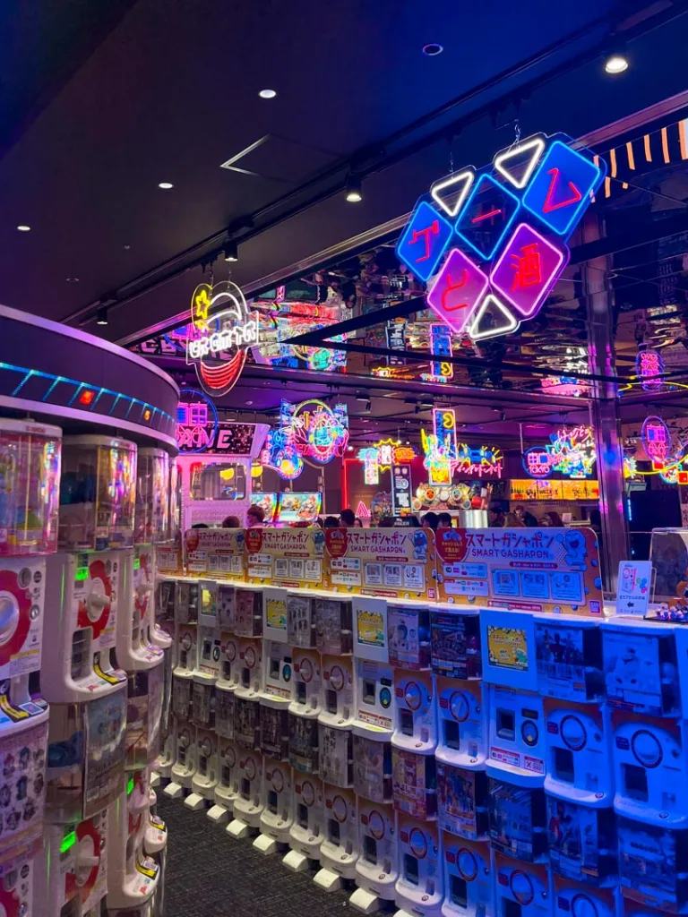 neon lights and stacks of vending machines at kabukicho tower in shinjuku, tokyo