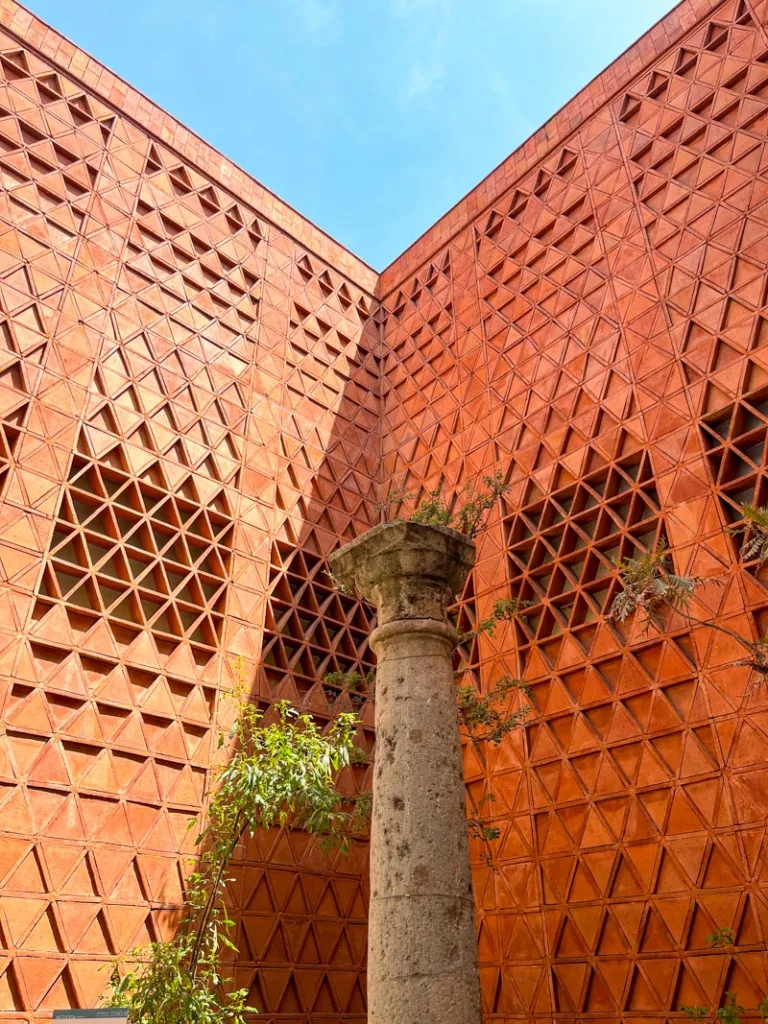 red brick wall with geometrical shapes at a textile museum in oaxaca city