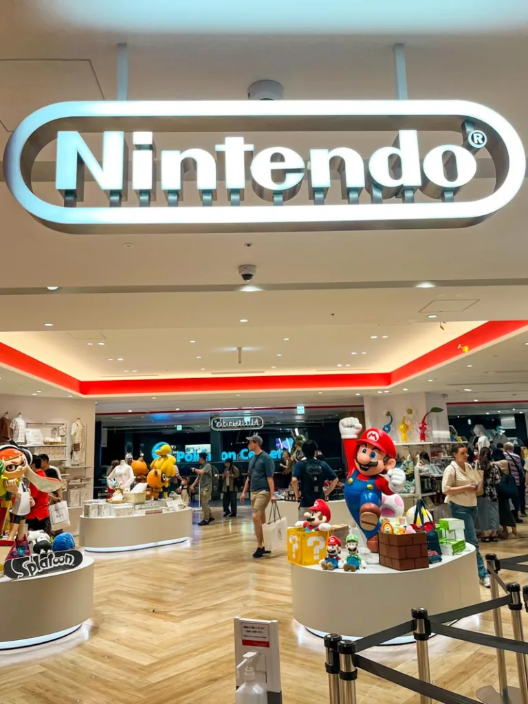 entrance to the nintendo store in tokyo with a big nintendo sign