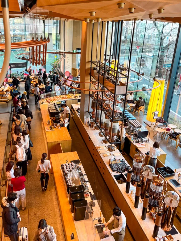 birds eye view of the coffee bar downstairs from the second floor of starbucks roastery in nakameguro, tokyo
