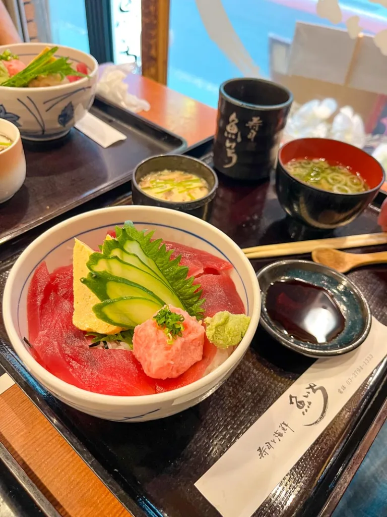 salmon bowl, miso soup and steamed egg on a tray at uoichi sushi restaurant in nakameguro, tokyo