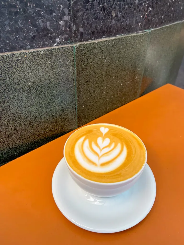 latte on a table at quentin coffee shop in mexico city