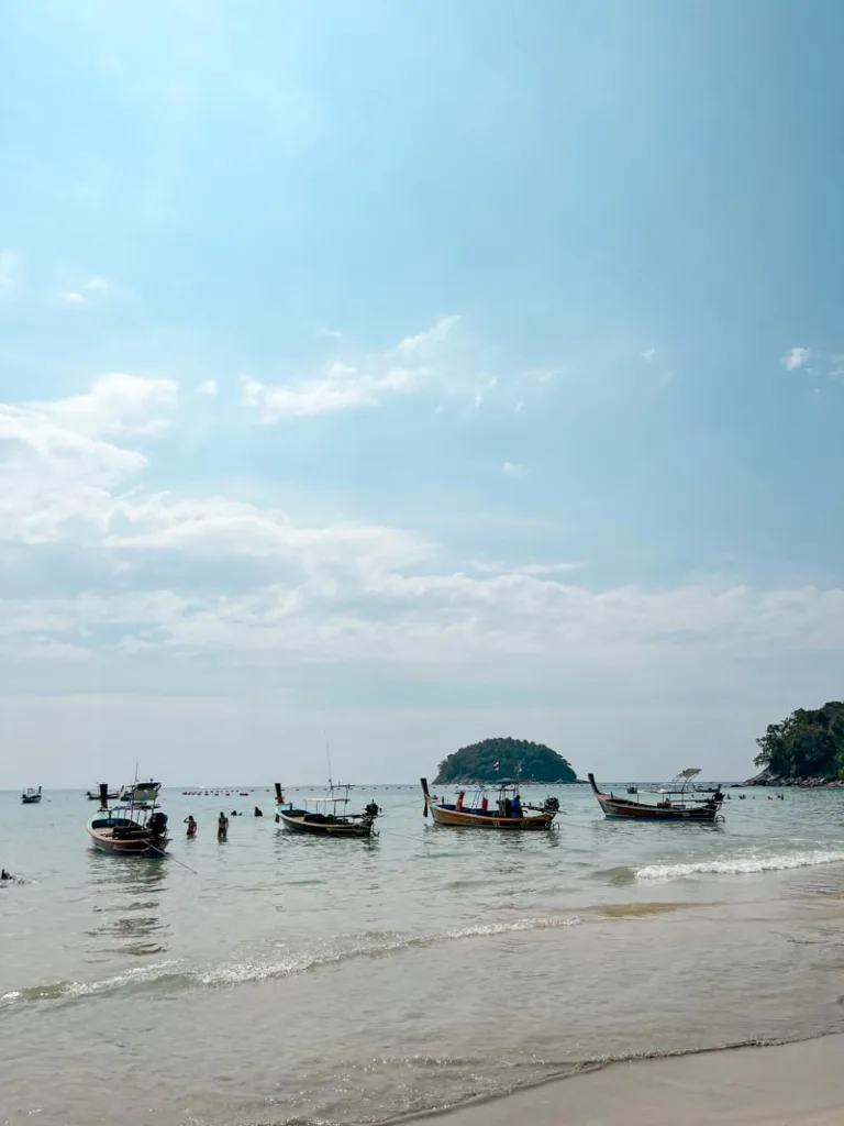longtail boats on the water in thailand