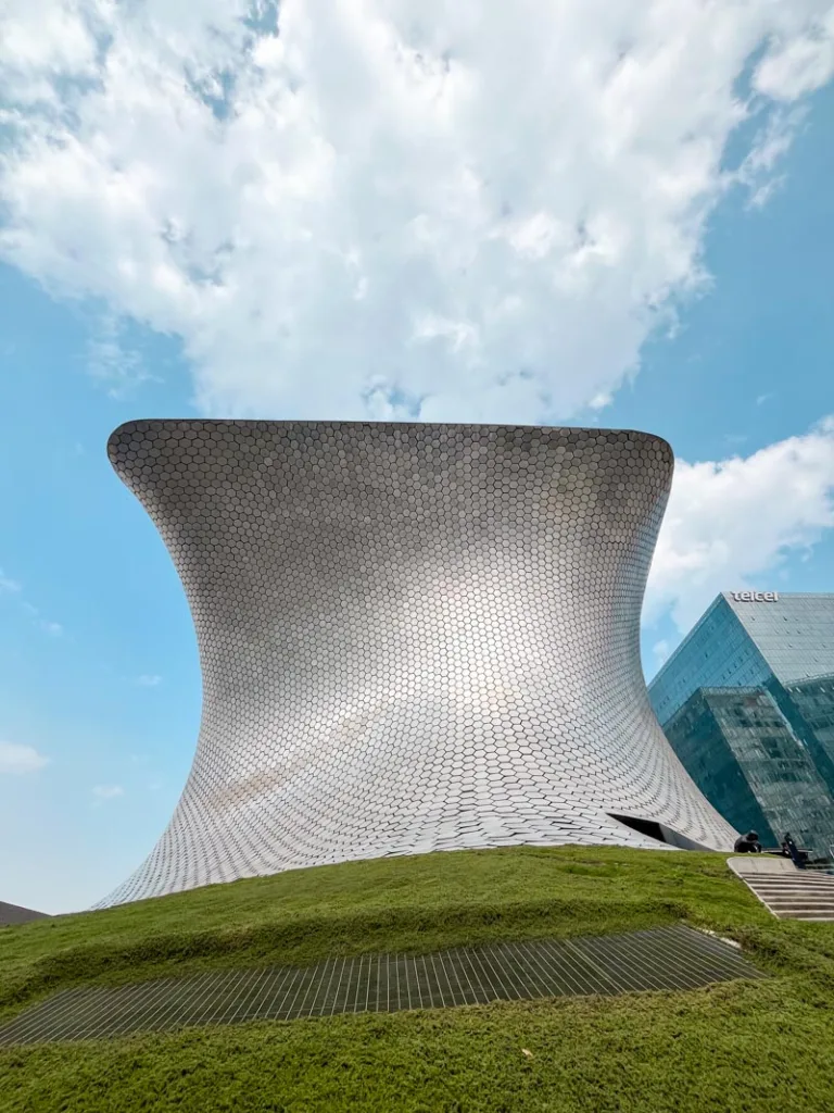 modern, silver and curved exterior of soumaya museum in mexico city