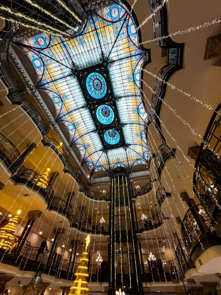 colorful stained glass ceiling inside gran hotel in mexico city