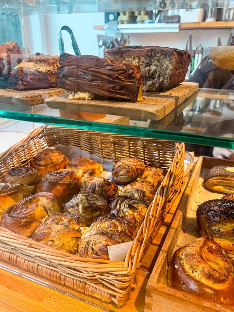 pastries on display at hjem coffee shop in kensington, london