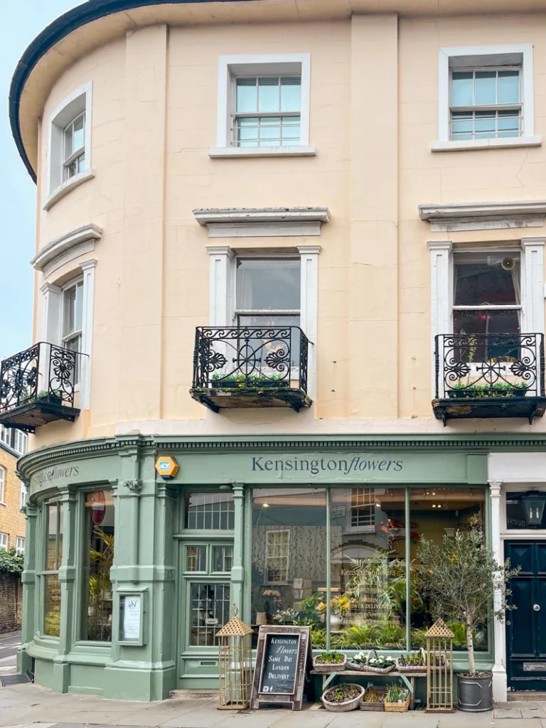 sage green facade of a flower shop in kensington, london