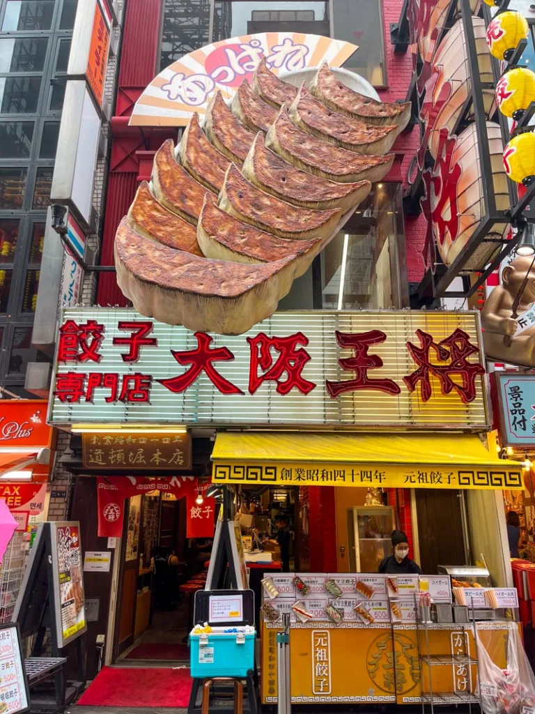 massive 3D gyoza structure outside a restaurant in dotonbori, a must visit during 24 hours in osaka