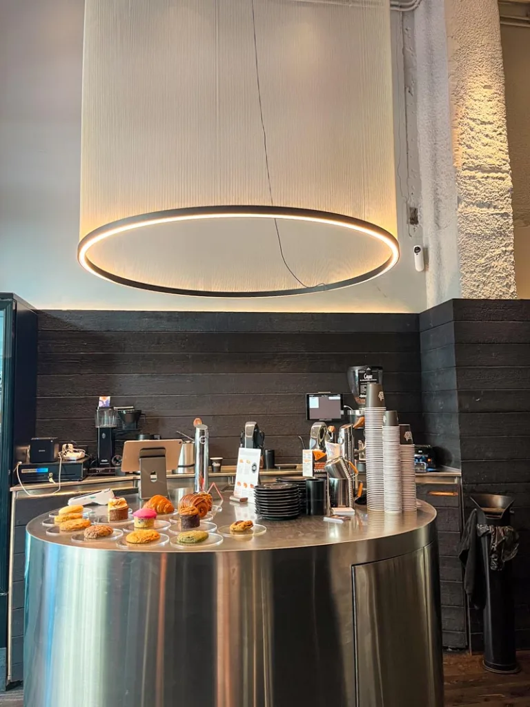 futuristic-looking silver coffee bar at hidden coffee roasters in barcelona