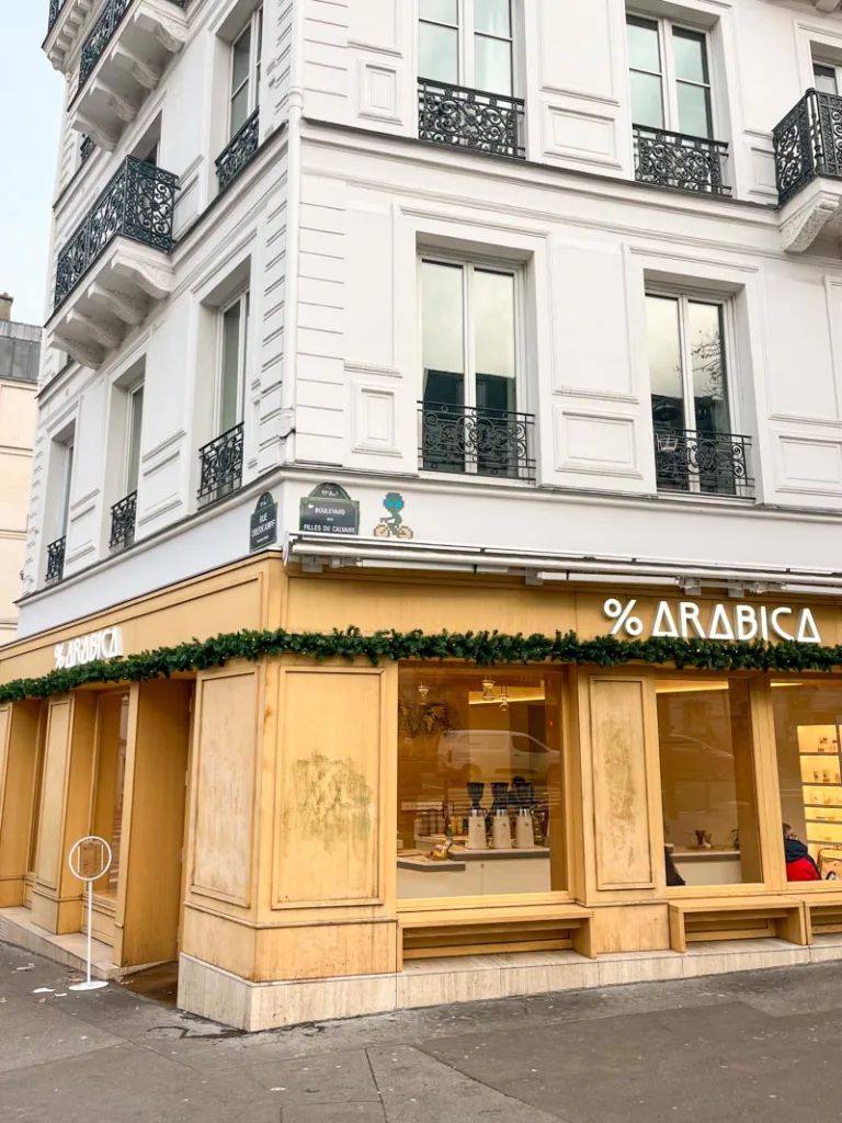 light wood facade of the %arabica coffee shop in oberkampf, paris