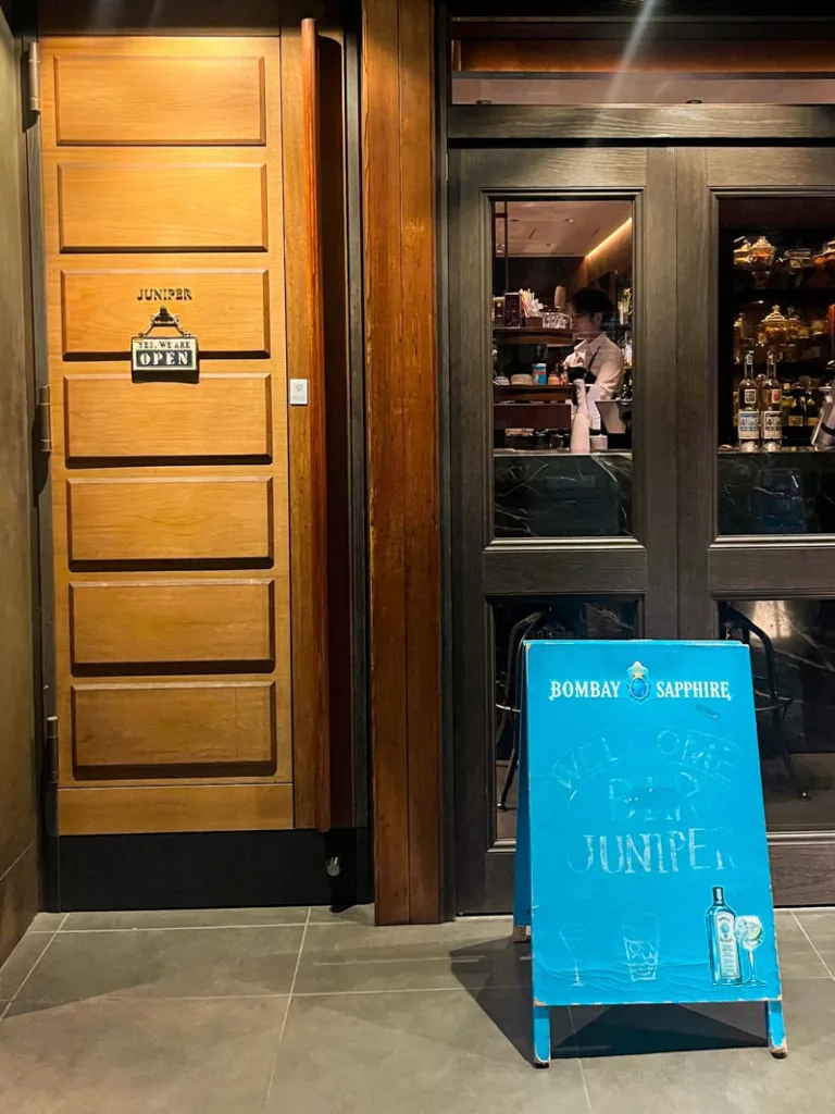 Wooden entrance door of Bar Juniper in Osaka