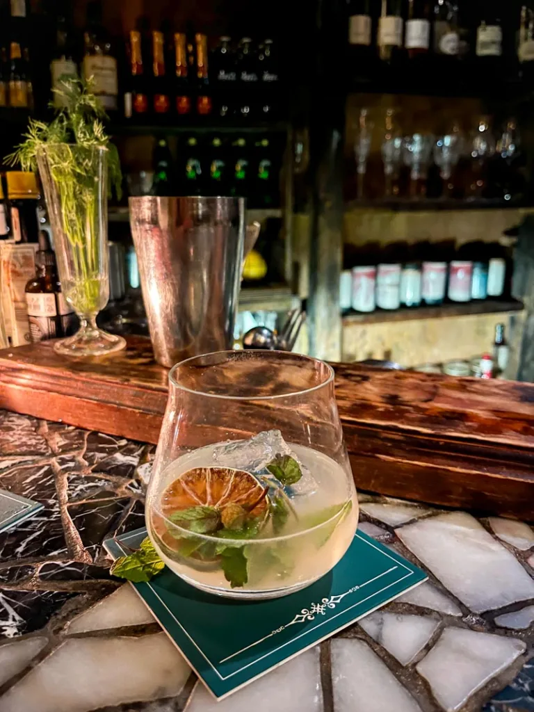 Cocktail on a marble bar at Bar Nayuta, one of the cool bars in Osaka to visit