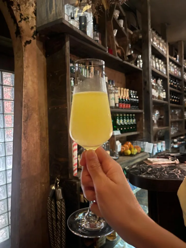 Hand holding a cocktail at Bar Nayuta in Osaka