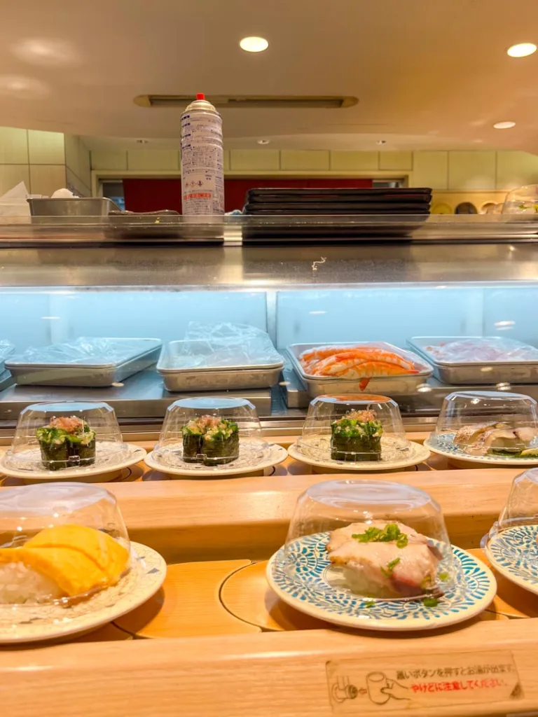 sushi plates at a conveyor belt sushi restaurant in Osaka