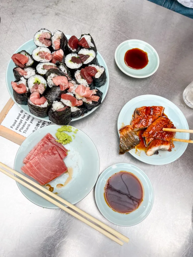 Various sea food dishes on a table at  izakaya Toyo in Osaka