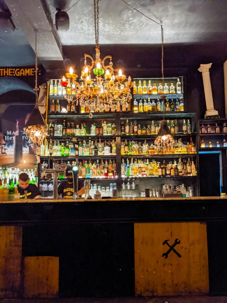 View of the bottles behind the bar at Freni e Frizione