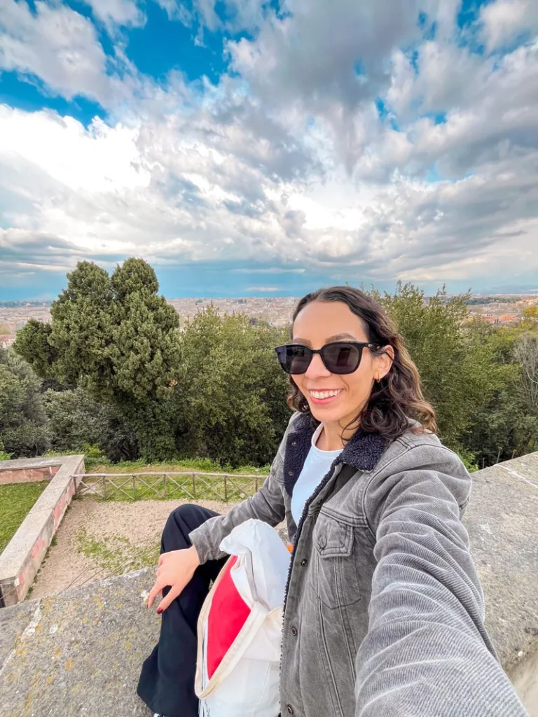 Selfie of a woman sitting on top of Janiculum Hill in Trastevere