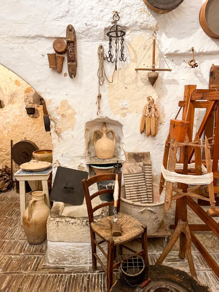 Authentic furniture and tools inside Casa Grota di Vico Solitario in Matera