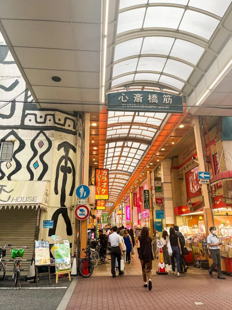 covered shinsaibashi shopping street in osaka lined with shops and restaurants