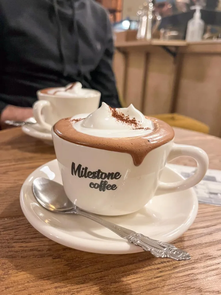 two cups of decadent looking hot chocolates with whipped cream at milestone coffee in seoul