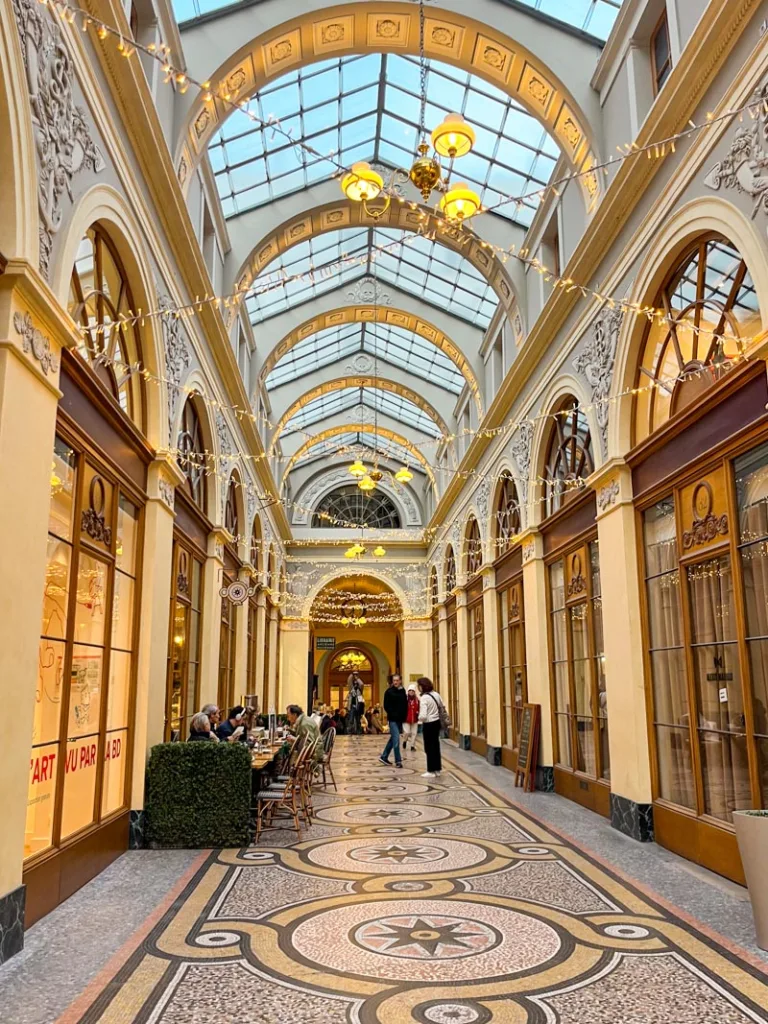 warm toned covered passage of galerie vivienne in paris