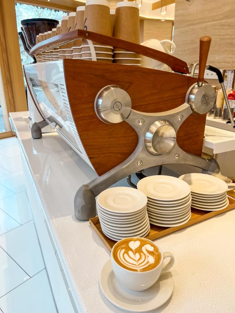 a kyotto latte in a ceramic mug at the white coffee bar of %arabica in paris